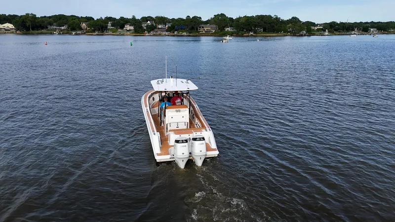 Slide: The Image of 2000 Hydra-Sports 2796 Vector boat cruising on a calm lake. - 15
