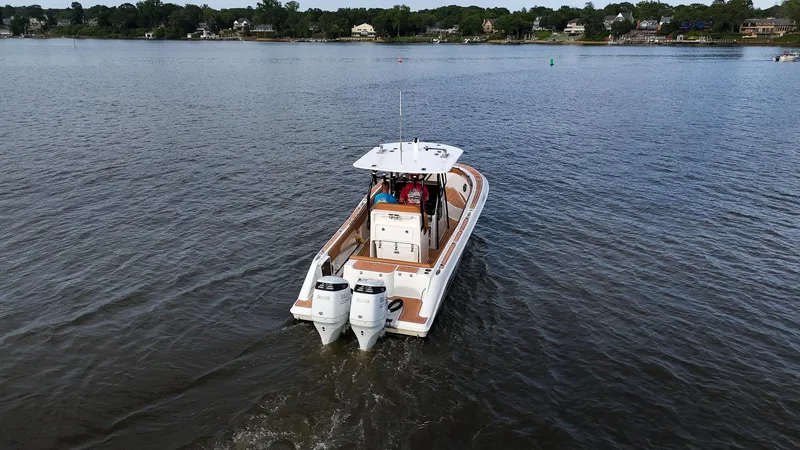 Slide: The Image of 2000 Hydra-Sports 2796 Vector boat cruising on a calm lake. - 16