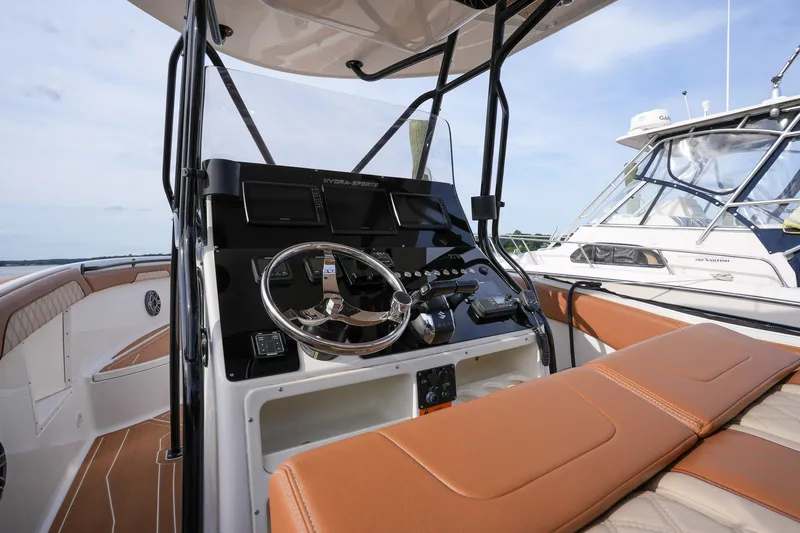 Slide: The Image of 2000 Hydra-Sports 2796 Vector boat cockpit with steering wheel and tan seating. - 28