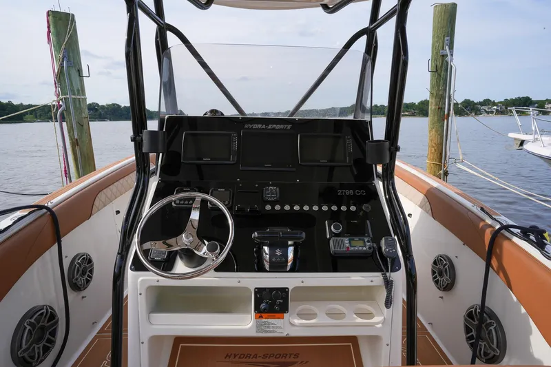 Slide: The Image of 2000 Hydra-Sports 2796 Vector boat dashboard with steering wheel and controls. - 29