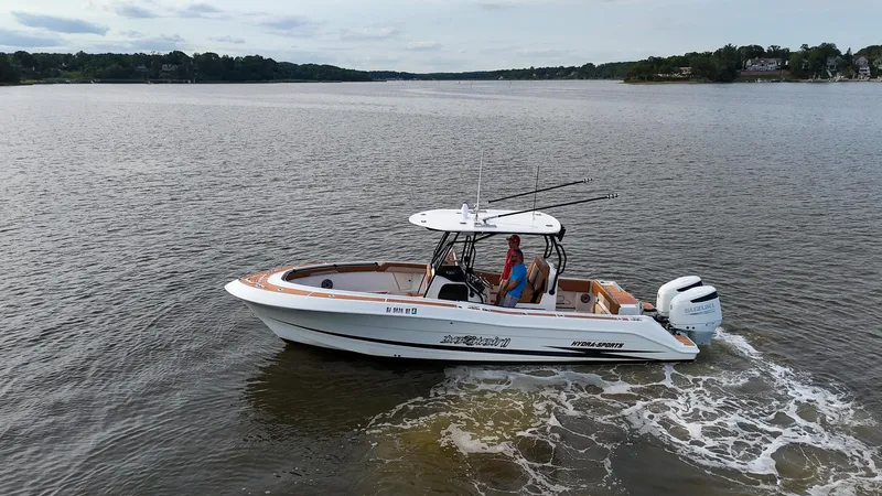 Slide: The Image of 2000 Hydra-Sports 2796 Vector boat cruising on a calm lake. - 3