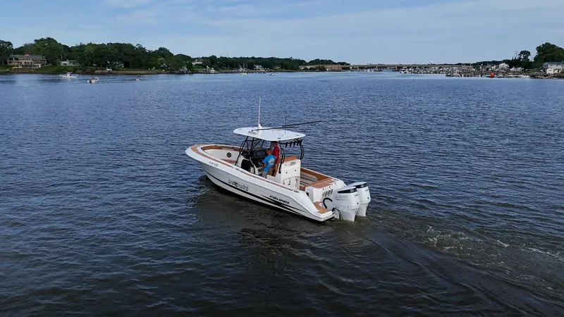 Slide: The Image of 2000 Hydra-Sports 2796 Vector boat cruising on a calm lake. - 7