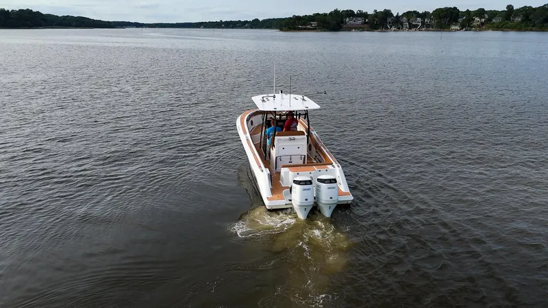 Slide: The Image of 2000 Hydra-Sports 2796 Vector boat cruising on a calm lake. - 8
