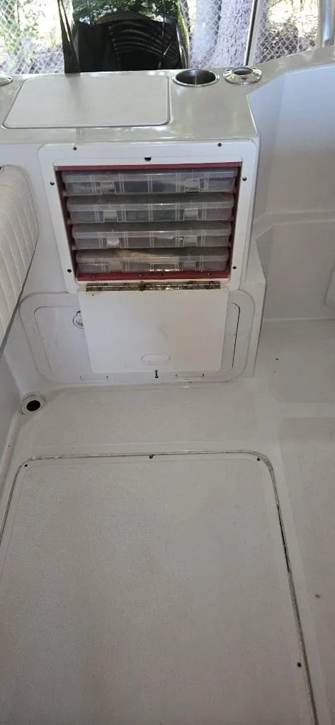 Slide: The Image of 2007 Glacier Bay 2640 Renegade boat interior with storage compartments. - 11