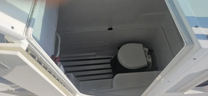 Slide: The Image of 2007 Glacier Bay 2640 Renegade boat interior with marine toilet. - 13