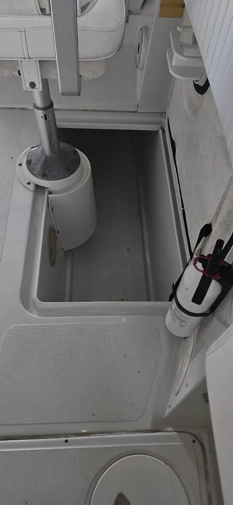 Slide: The Image of 2007 Glacier Bay 2640 Renegade boat interior with storage compartment and seating. - 15