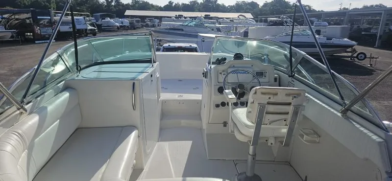 Slide: The Image of 2007 Glacier Bay 2640 Renegade boat interior with seating and steering console. - 5