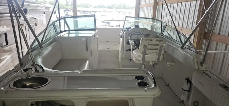 Slide: The Image of 2007 Glacier Bay 2640 Renegade boat interior with seating and control console. - 8