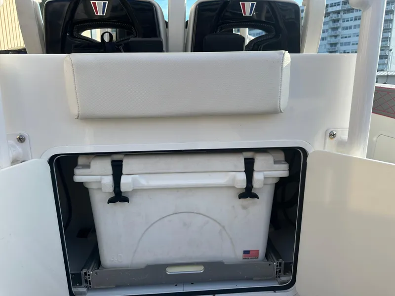 Slide: The Image of 2020 Wellcraft 302 Fisherman boat storage compartment with cooler. - 11