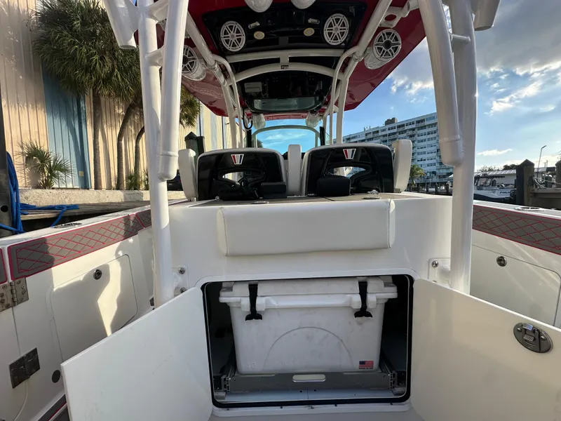 Slide: The Image of 2020 Wellcraft 302 Fisherman boat interior with open storage compartment. - 12