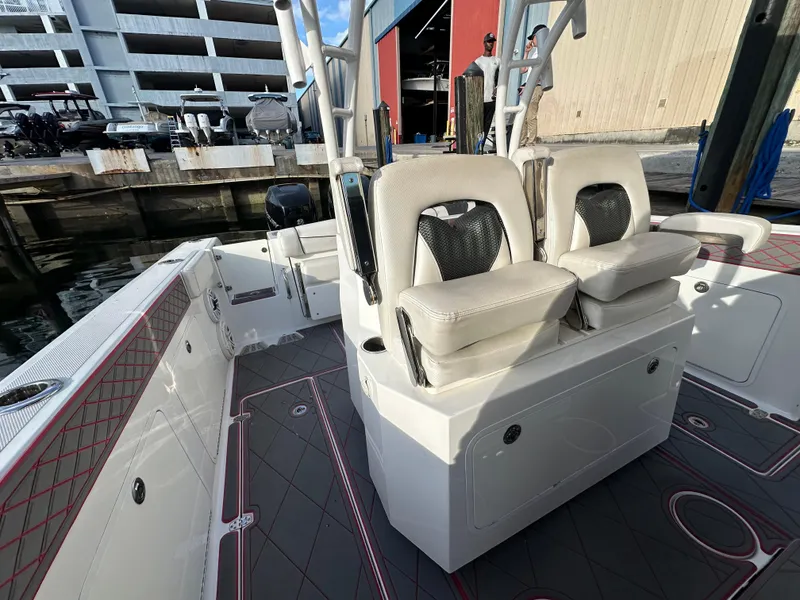 Slide: The Image of 2020 Wellcraft 302 Fisherman boat interior with cushioned seating and modern design. - 13