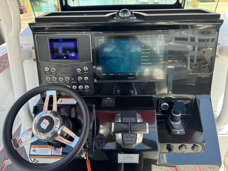 Slide: The Image of 2020 Wellcraft 302 Fisherman dashboard with advanced navigation and control systems. - 15