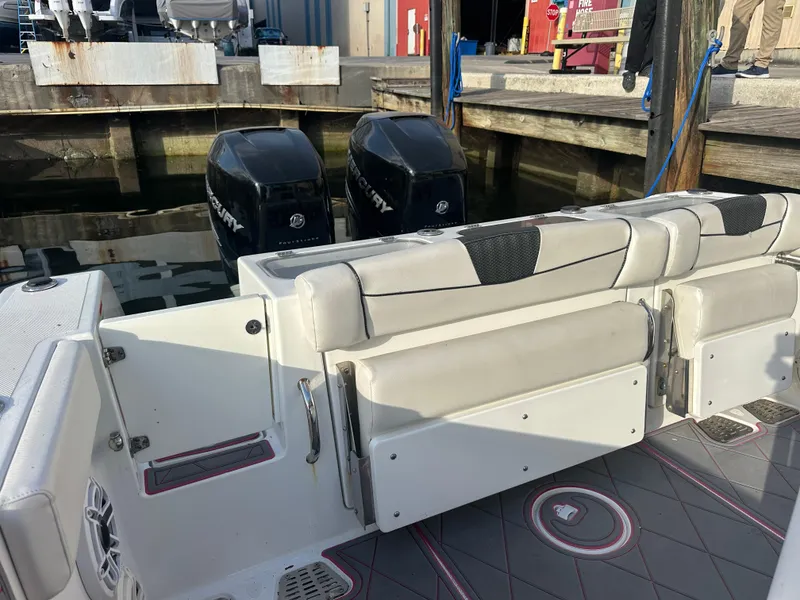 Slide: The Image of 2020 Wellcraft 302 Fisherman boat with dual Mercury engines at dock. - 7