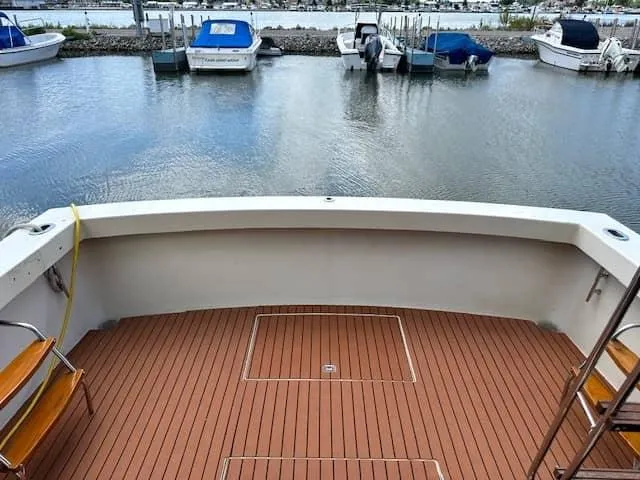 Slide: The Image of View from the deck of a 1985 Trojan T36 boat, overlooking a marina. - 15