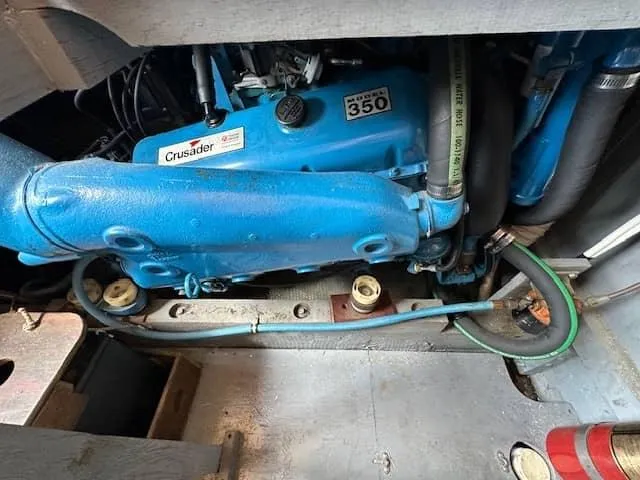 Slide: The Image of 1985 Trojan T36 Crusader 350 engine in boat compartment. - 24