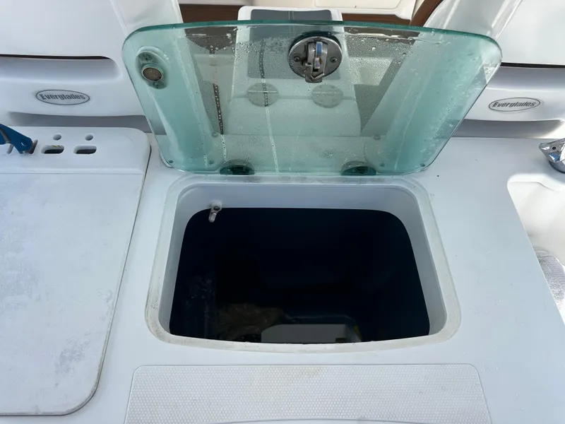 Slide: The Image of Open storage compartment on a 2008 Everglades 350 CC boat. - 12