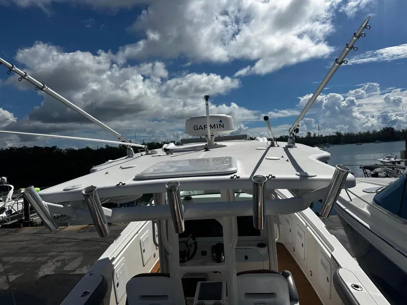 Slide: The Image of 2008 Everglades 350 CC boat with fishing rod holders and Garmin equipment. - 14