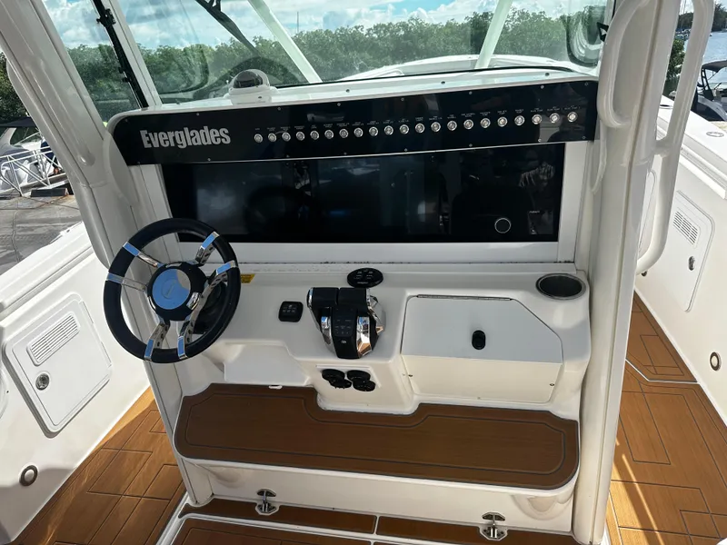 Slide: The Image of 2008 Everglades 350 CC boat helm with steering wheel and control panel. - 17