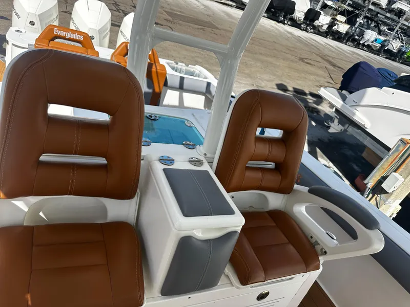 Slide: The Image of 2008 Everglades 350 CC boat interior with brown leather seats and control panel. - 18