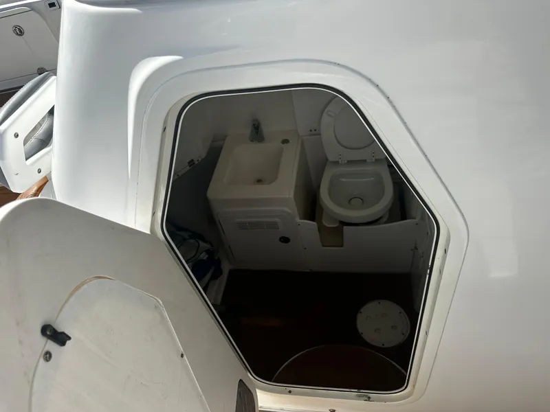 Slide: The Image of 2008 Everglades 350 CC boat interior bathroom with sink and toilet. - 20