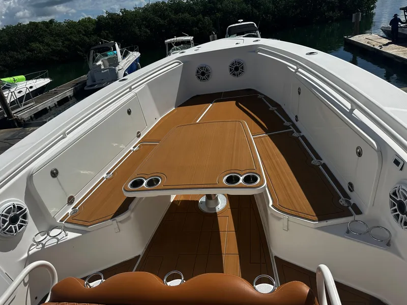 Slide: The Image of 2008 Everglades 350 CC boat with spacious deck and seating area. - 21
