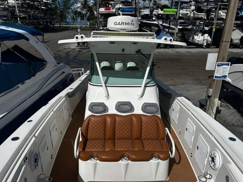 Slide: The Image of 2008 Everglades 350 CC boat with Garmin navigation system docked at marina. - 23