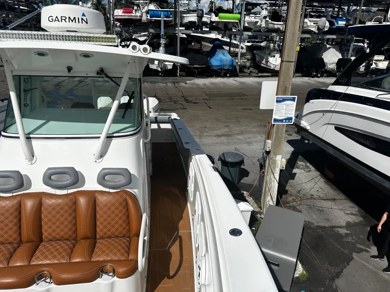 Slide: The Image of 2008 Everglades 350 CC boat with Garmin equipment at a marina. - 24