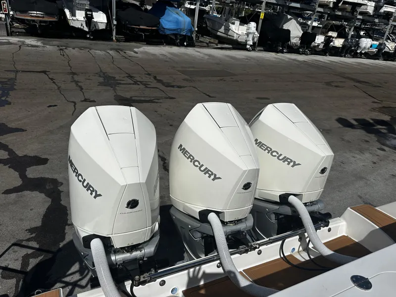 Slide: The Image of Triple Mercury outboard engines on a 2008 Everglades 350 CC boat. - 5