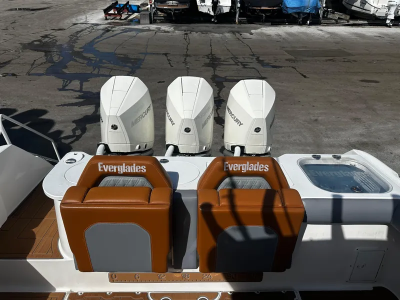 Slide: The Image of 2008 Everglades 350 CC boat with triple Mercury engines at dock. - 8