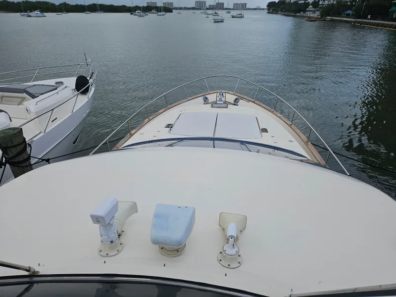 Slide: The Image of Astondoa 72 GLX yacht on calm water, 1998 model, extended platform view. - 12