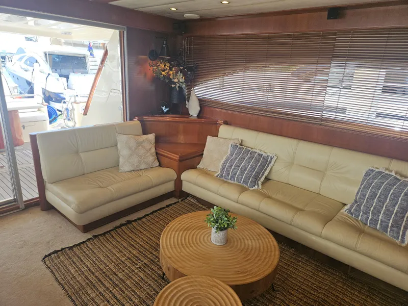 Slide: The Image of Luxurious interior of 1998 Astondoa 72 GLX yacht with beige leather seating and wooden accents. - 18