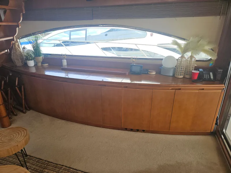 Slide: The Image of Interior of 1998 Astondoa 72 GLX yacht with wooden cabinetry and decorative items. - 20