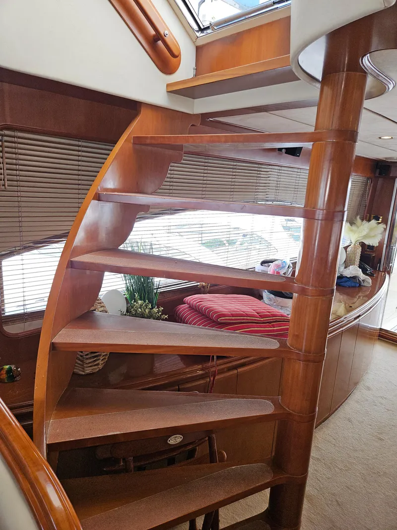 Slide: The Image of Wooden spiral staircase inside 1998 Astondoa 72 GLX yacht, elegant interior design. - 22