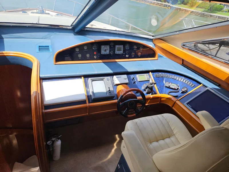 Slide: The Image of Interior cockpit of 1998 Astondoa 72 GLX yacht with modern controls and leather seating. - 25