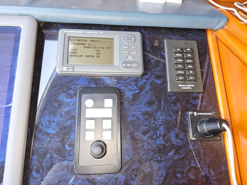 Slide: The Image of Control panel of 1998 Astondoa 72 GLX yacht with navigation and system controls. - 31