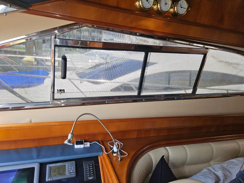 Slide: The Image of Interior view of 1998 Astondoa 72 GLX yacht with window and control panel. - 32