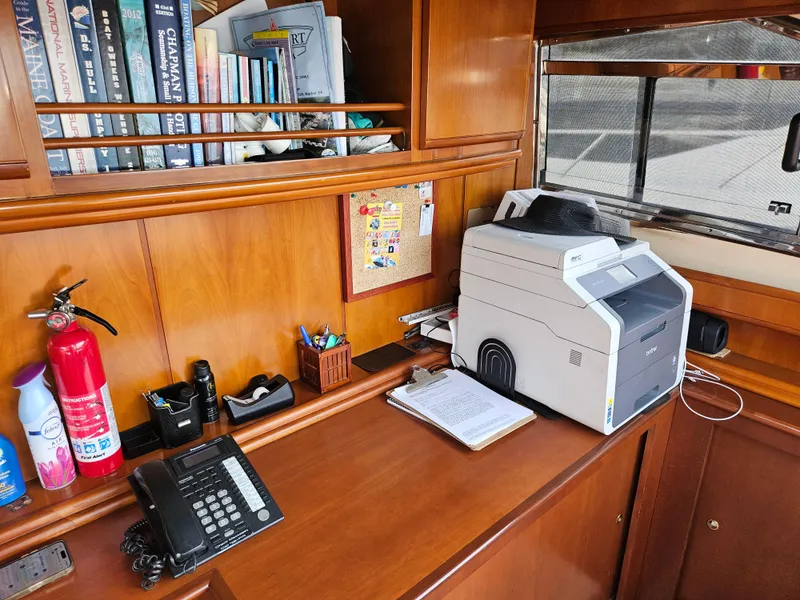 Slide: The Image of Office area on 1998 Astondoa 72 GLX yacht with printer, phone, and books. - 37