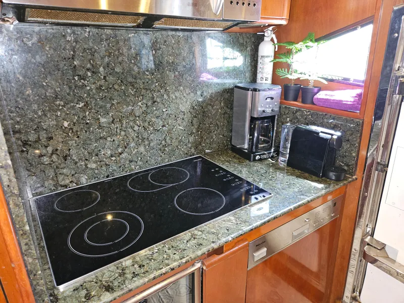 Slide: The Image of Astondoa 72 GLX 1998 yacht kitchen with granite countertops and modern appliances. - 39