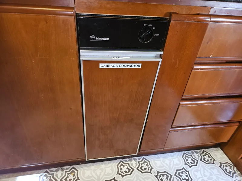 Slide: The Image of Wooden kitchen cabinetry with a built-in Monogram garbage compactor on Astondoa 72 GLX yacht. - 41