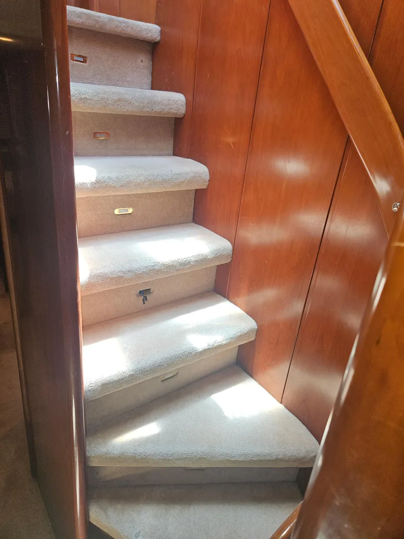 Slide: The Image of Interior staircase of 1998 Astondoa 72 GLX yacht with wooden paneling. - 42