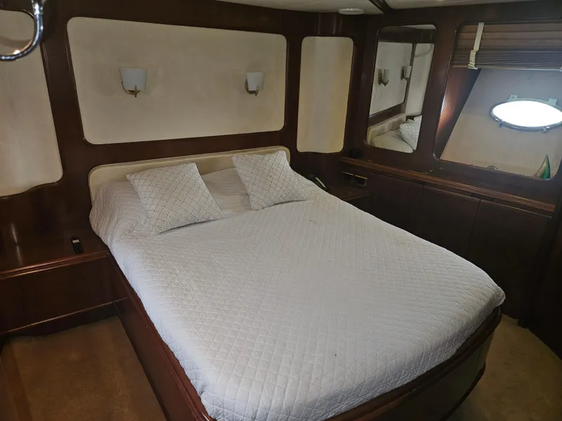 Slide: The Image of Luxurious bedroom interior of 1998 Astondoa 72 GLX yacht with elegant wood finishes. - 47