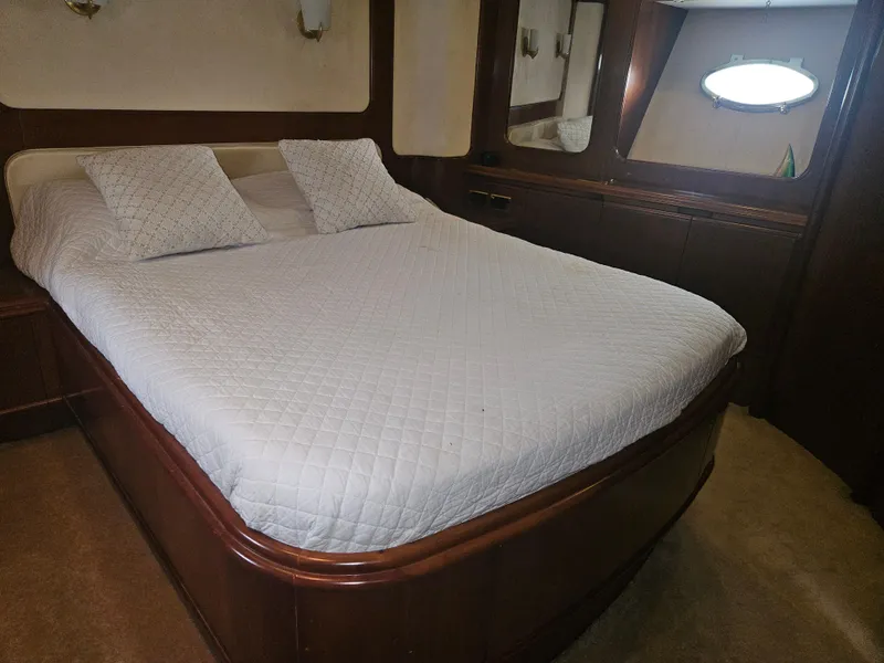 Slide: The Image of Luxurious bedroom interior of 1998 Astondoa 72 GLX yacht with elegant wood finish. - 48