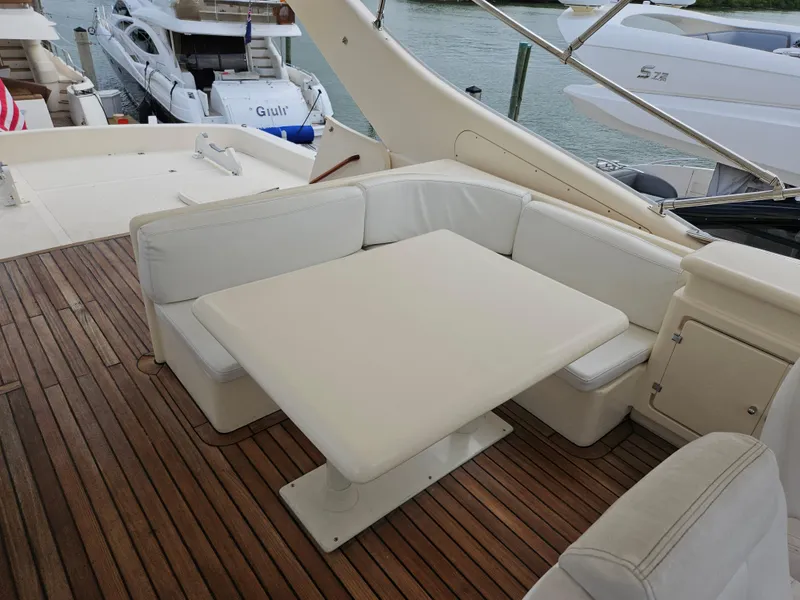 Slide: The Image of Astondoa 72 GLX yacht deck with white seating and table, 1998 model. - 7