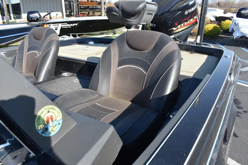 Slide: The Image of 2019 Ranger Z521L boat with black leather seats and Yamaha motor. - 2