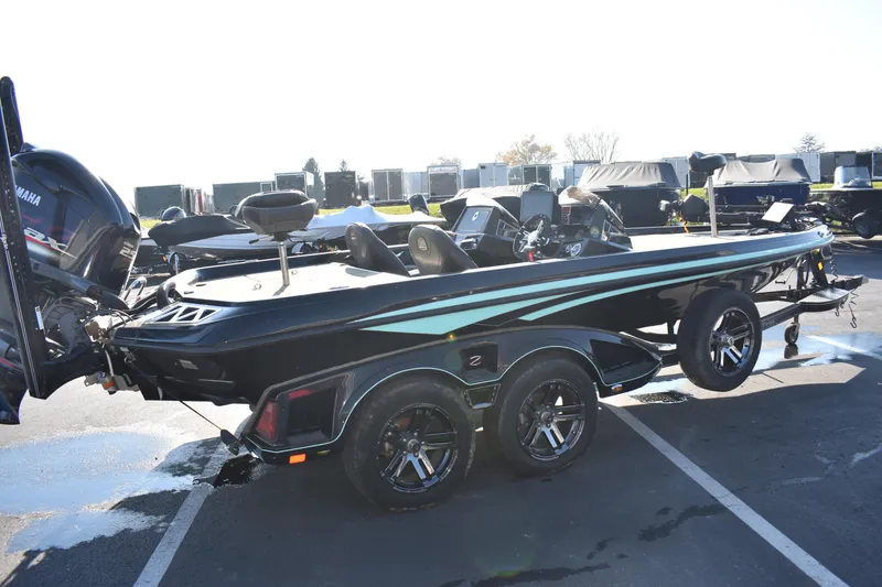 Slide: The Image of 2019 Ranger Z521L bass boat with Yamaha outboard motor in parking lot. - 4