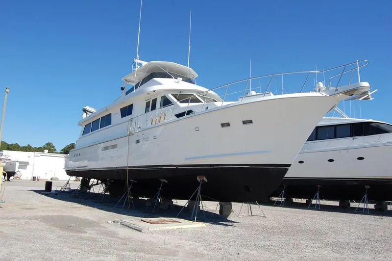 The Image of 1990 Hatteras 78 Aft Cockpit Motoryacht on dry dock for maintenance. - 0