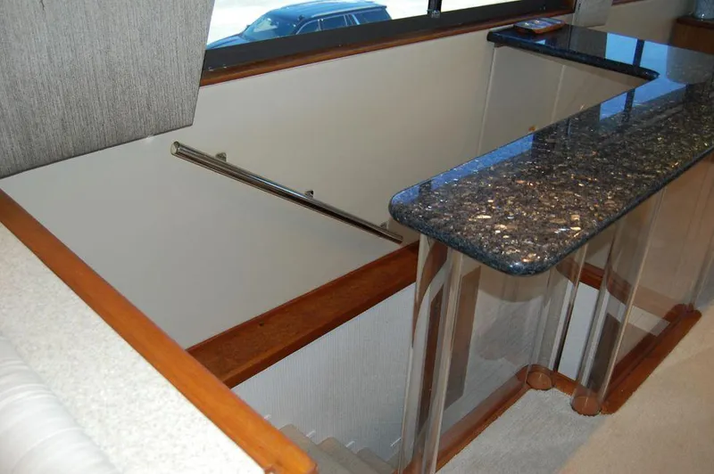 Slide: The Image of Interior staircase of 1990 Hatteras 78 Aft Cockpit Motoryacht with granite countertop. - 17