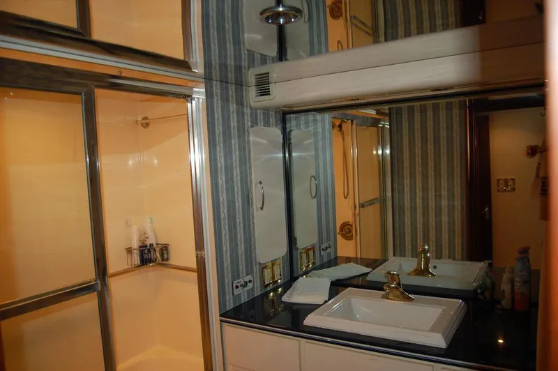 Slide: The Image of Luxurious bathroom in 1990 Hatteras 78 Aft Cockpit Motoryacht with shower and vanity. - 25