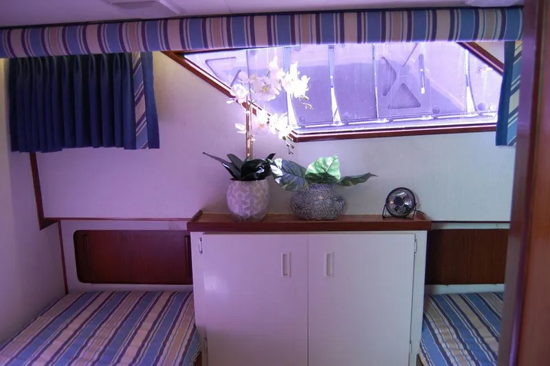 Slide: The Image of Interior cabin of 1990 Hatteras 78 Aft Cockpit Motoryacht with twin beds and window. - 31