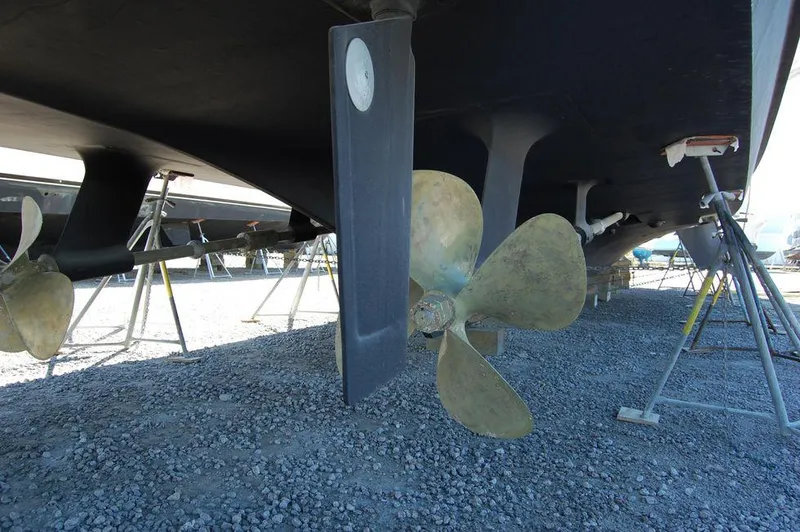 Slide: The Image of Propellers and rudders of a 1990 Hatteras 78 Aft Cockpit Motoryacht on dry dock. - 36